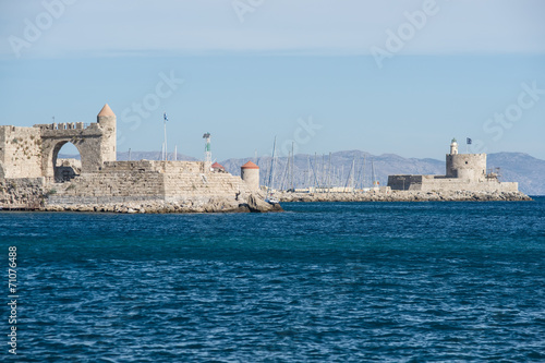 Harbour Gates and Lighthouse St. Nicholas at Rhodes, Greece.