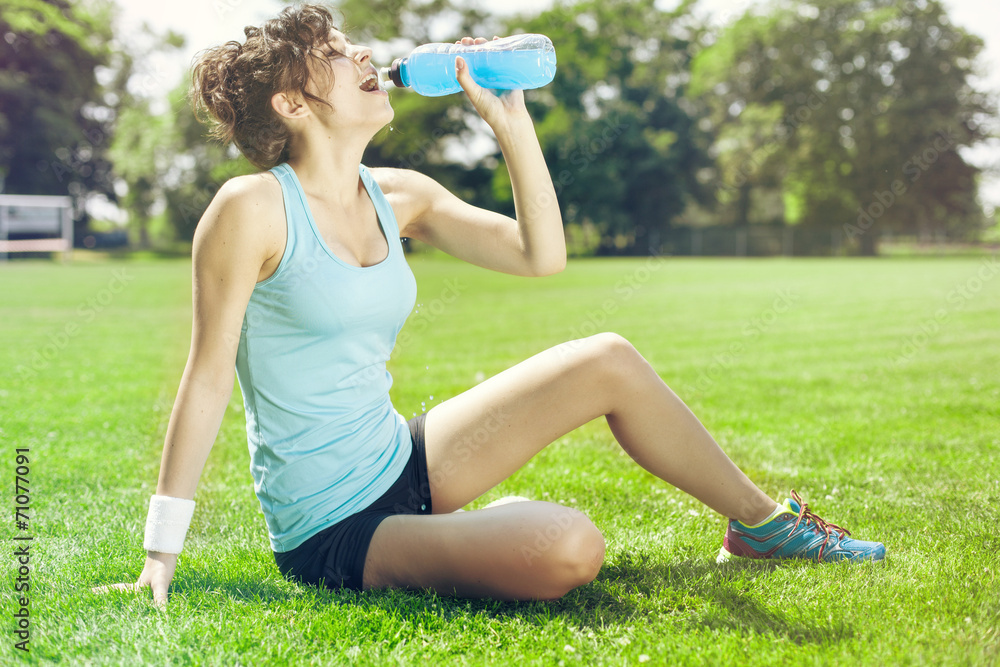 Tired woman runner taking a rest after run Tired woman runner taking a rest after run