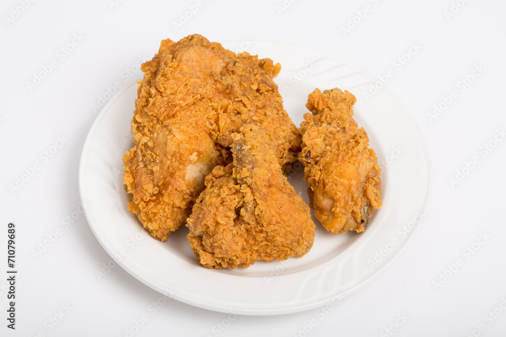 Fried Chicken Pieces on Small White Plate Fried Chicken Pieces on Small White Plate