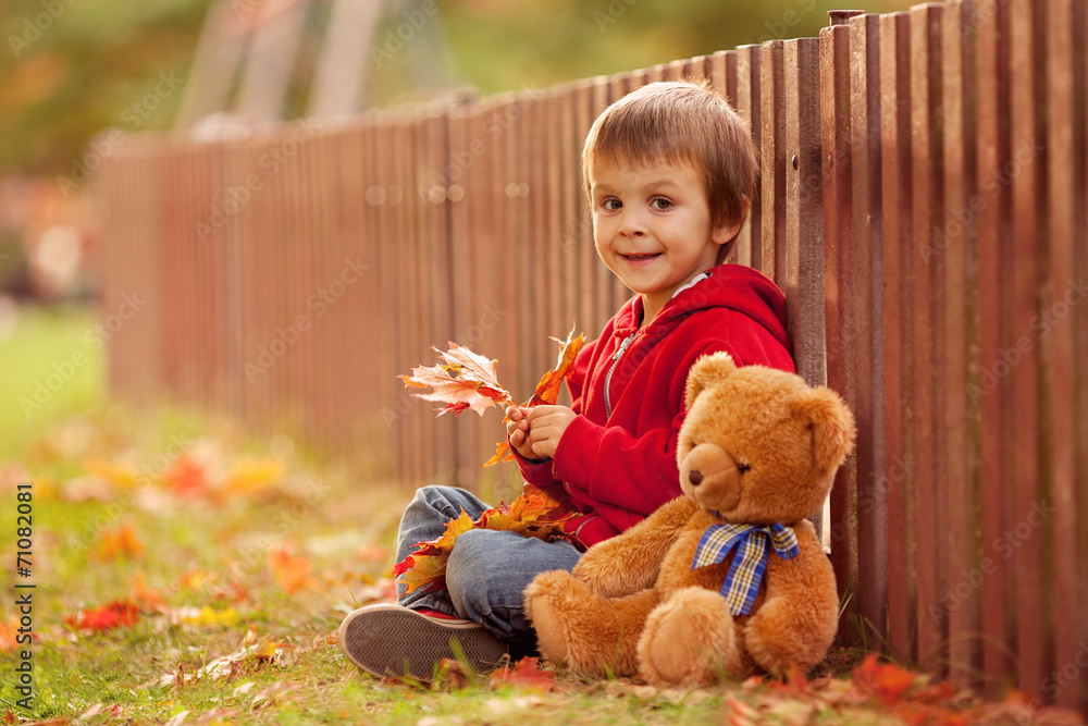 Adorable little boy with teddy bear in the park Adorable little boy with teddy bear in the park
