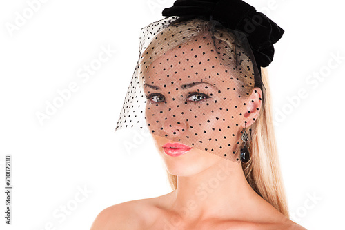 portrait of a beautiful woman with black veil on face photo