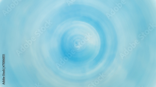 Spin blur cicle of bright blue sky