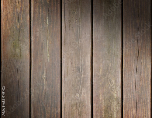 Weathered wooden plank background lit diagonally