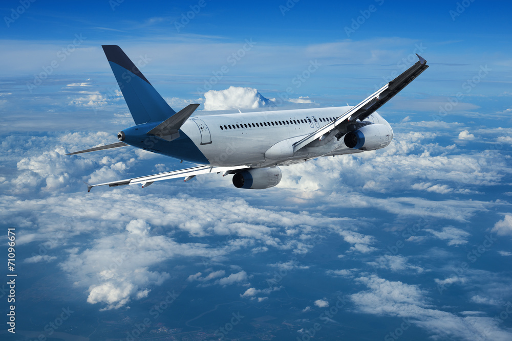 Obraz premium Jet cruising above the clouds