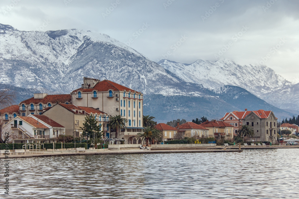 It's snowing in the mountains.  Tivat city, Montenegro
