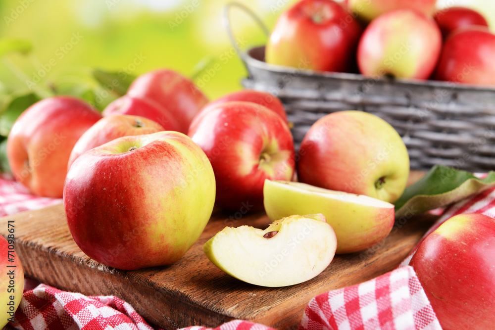 Sweet apples  on table on bright background