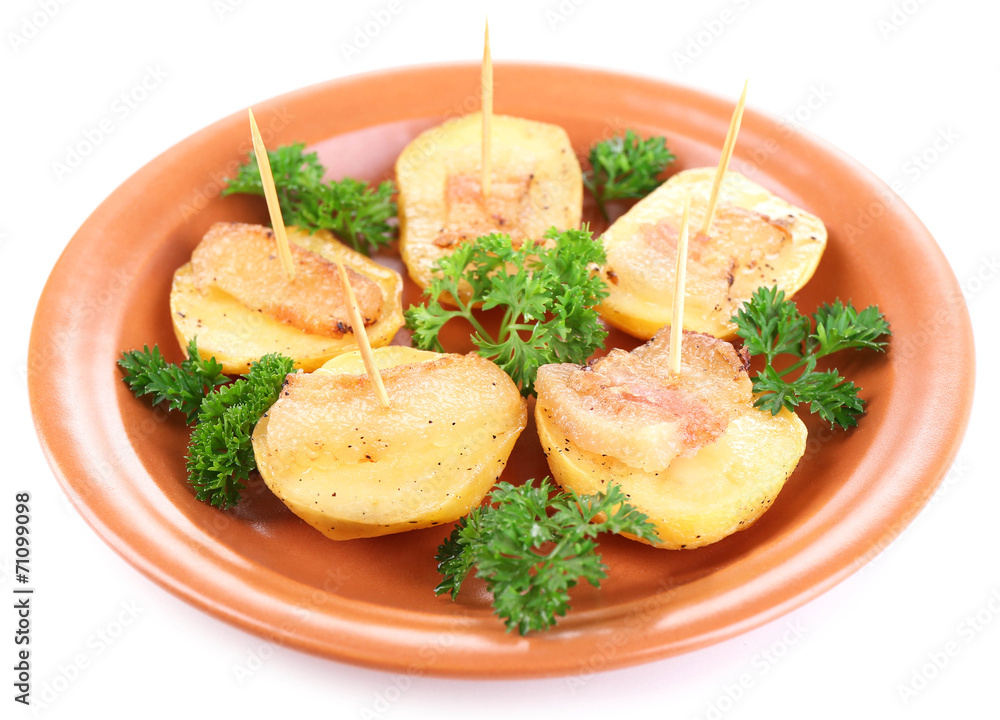 Baked potato with bacon on plate, isolated on white