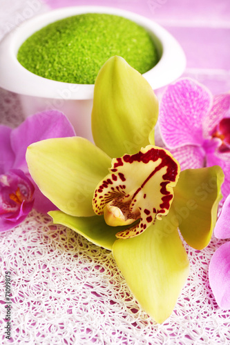 Fototapeta Naklejka Na Ścianę i Meble -  Tropical orchid flowers on color wooden background