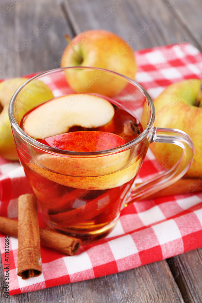 Apple cider with cinnamon sticks and fresh apples Apple cider with cinnamon sticks and fresh apples