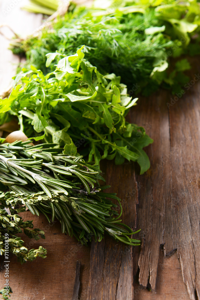 Different fresh herbs on wooden background Different fresh herbs on wooden background