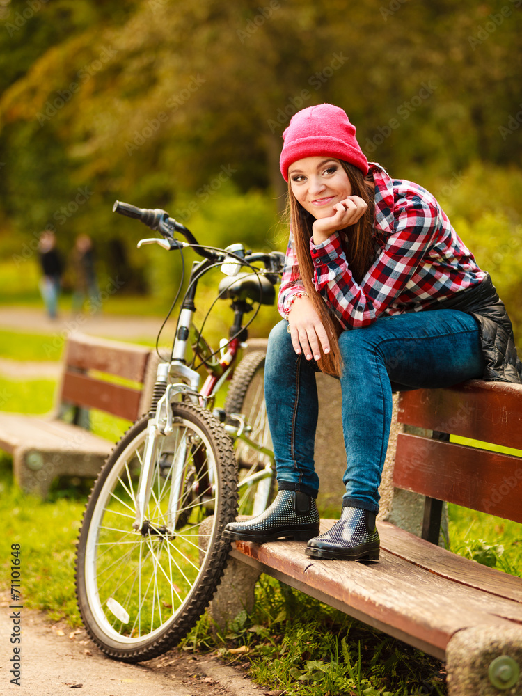 girl relaxing in autumnal park with bicycle. girl relaxing in autumnal park with bicycle.