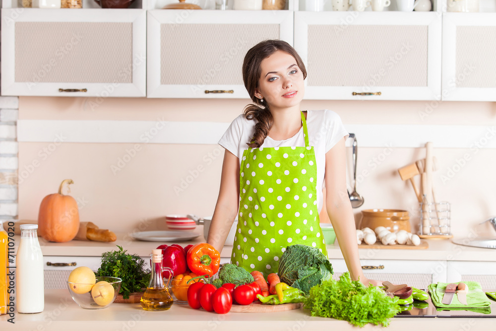 Young Woman Cooking in the kitchen. Healthy Food. Dieting Concep Young Woman Cooking in the kitchen. Healthy Food. Dieting Concep