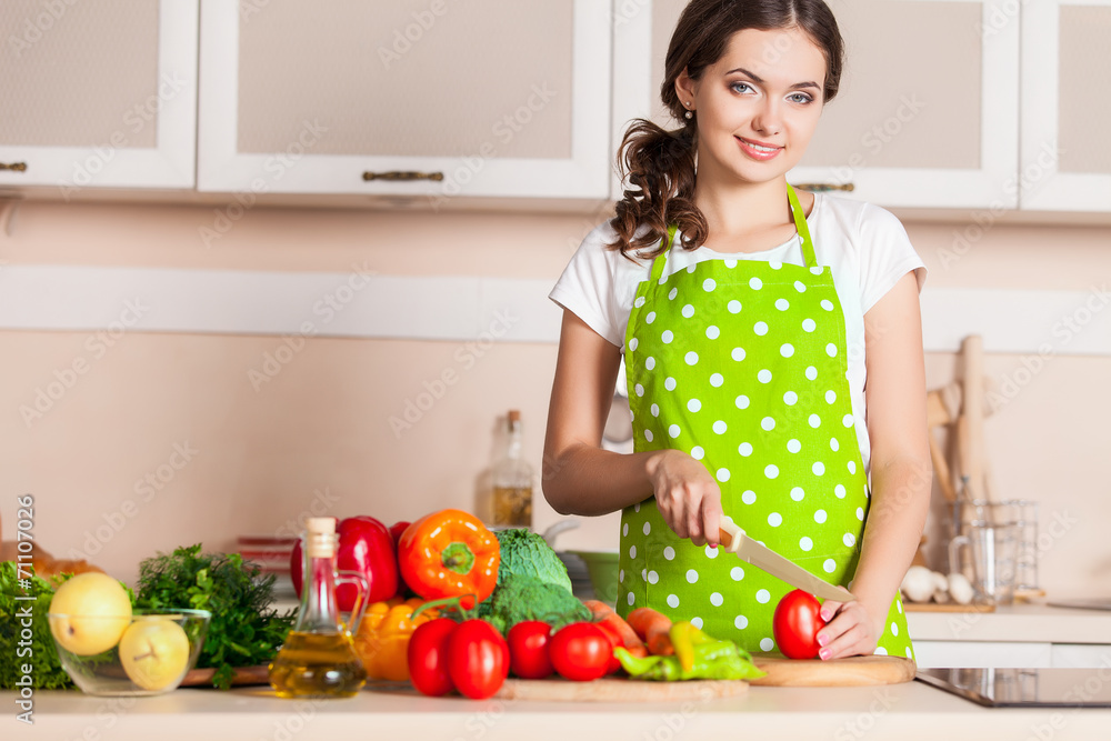 Young Woman Cooking in the kitchen. Healthy Food. Dieting Concep Young Woman Cooking in the kitchen. Healthy Food. Dieting Concep