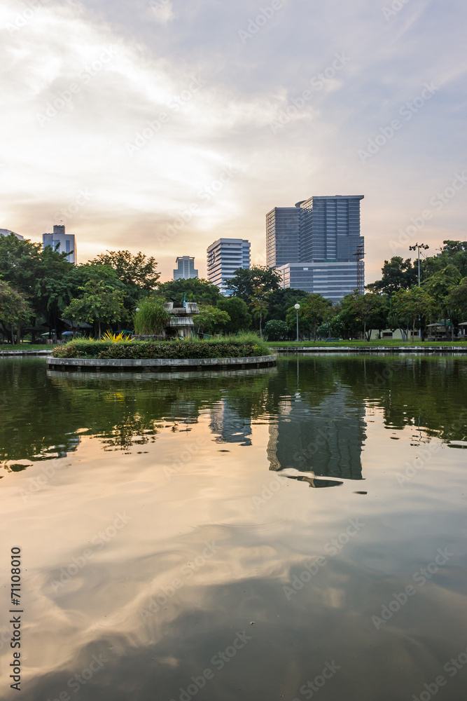 Modern building with lake in evening