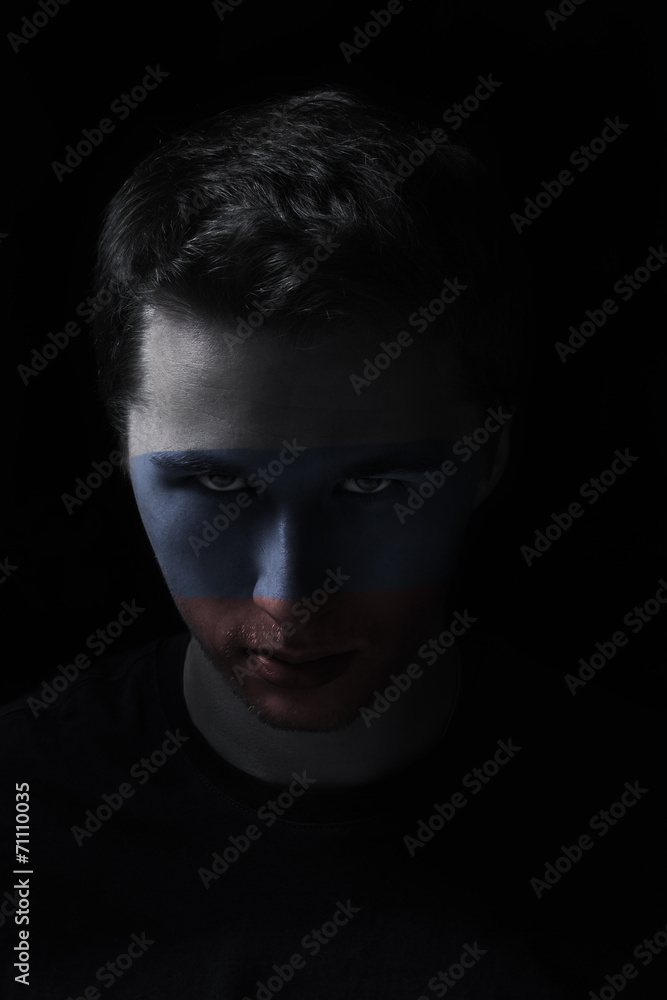 serios man face with painted flag colors of Russia serios man face with painted flag colors of Russia