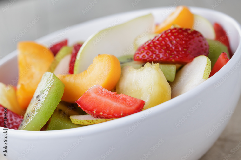 fresh mix fruit salad with strawberry, kiwi and peach fresh mix fruit salad with strawberry, kiwi and peach