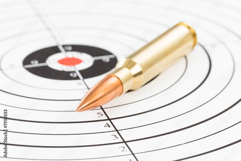 Rifle bullet over target background Rifle bullet over target background