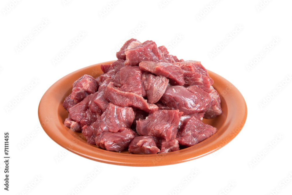 Pieces of beef on a plate isolated on white background