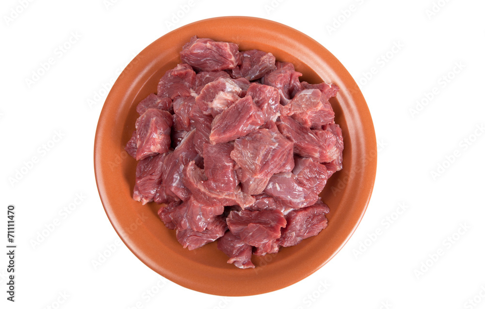 Pieces of beef on a plate isolated on white background Pieces of beef on a plate isolated on white background