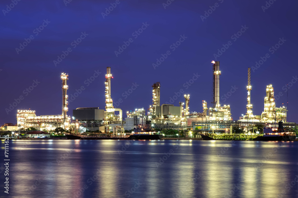 Oil refinery at twilight with reflection Oil refinery at twilight with reflection