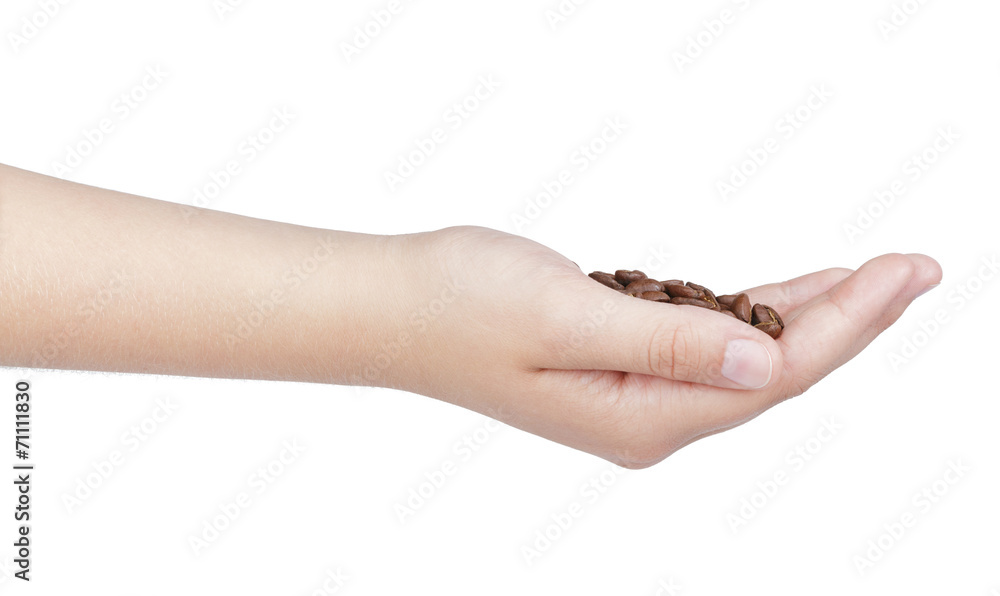 female teen hand hold coffee beans