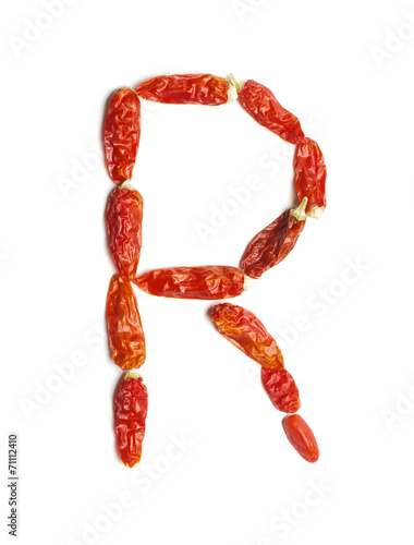 Alphabet letter R arranged from chili peppers isolated