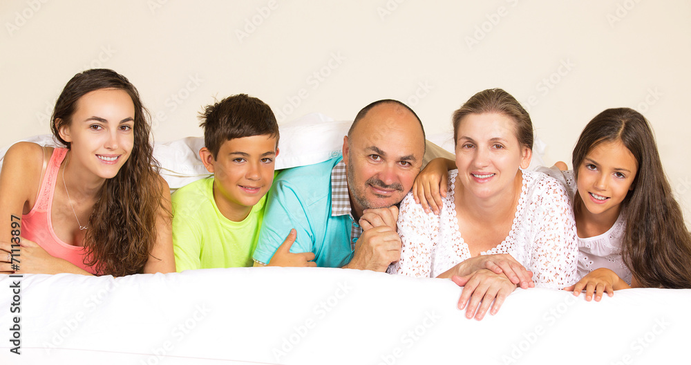 happy family under blanket