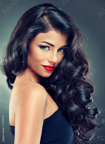 Model brunette with long curly hair Fototapeta