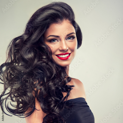 Model brunette with long curly hair Fototapeta