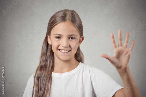 girl making five times sign gesture with hand grey background  photo