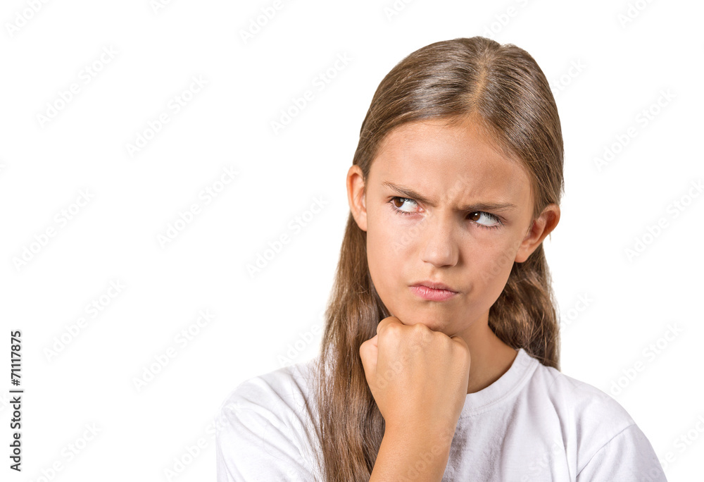 Headshot angry grumpy teenager girl on white background Headshot angry grumpy teenager girl on white background