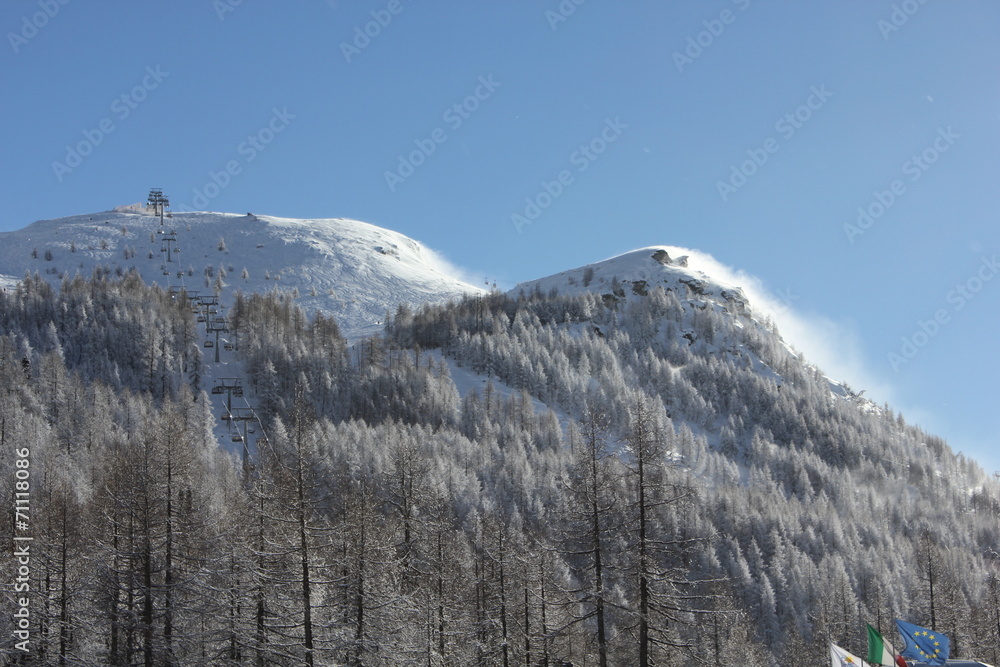Madesimo mountains covered with snow in a sunny day