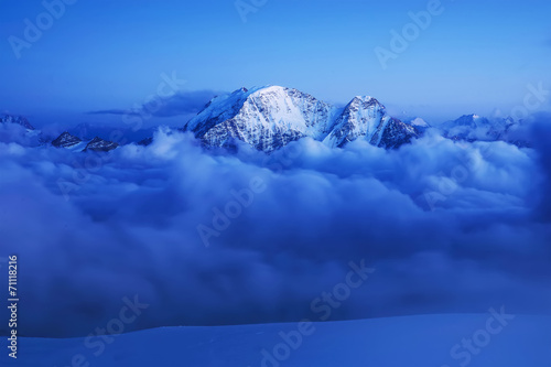 High mountain in the clouds. Beautiful natural landscape