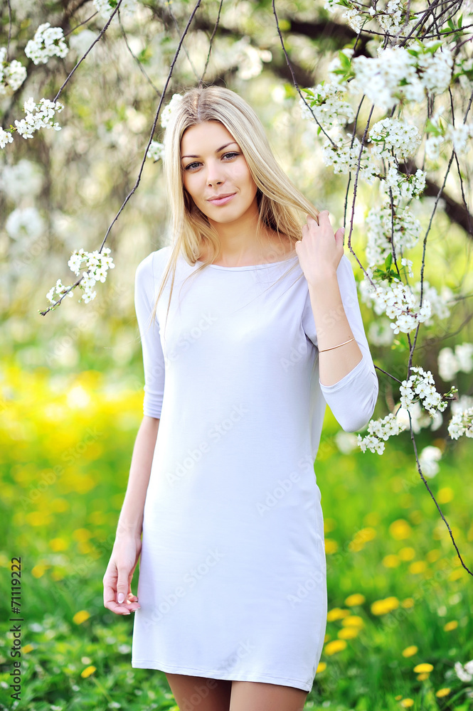 Portrait of the young beautiful smiling woman outdoors Portrait of the young beautiful smiling woman outdoors
