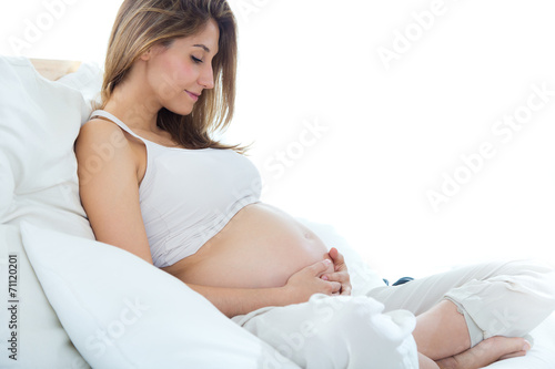 Pregnant woman relaxing at home.