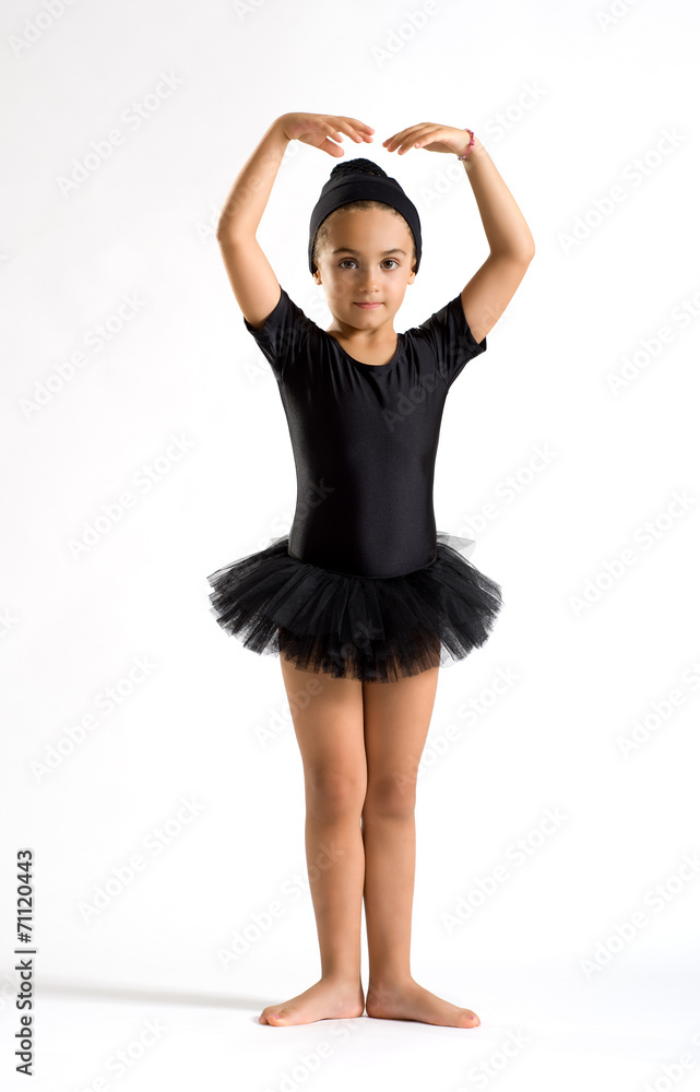 Small ballerina striking a graceful pose Small ballerina striking a graceful pose
