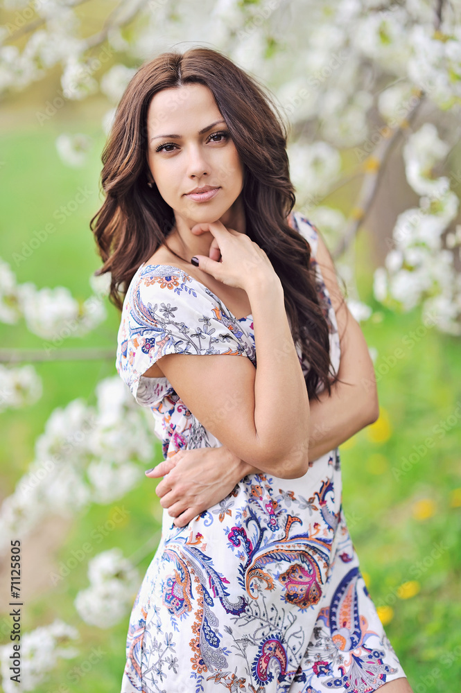 Fototapeta premium Portrait of the young beautiful smiling woman outdoors