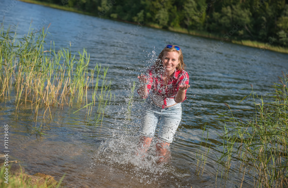 Smiling Girl playing in the water Smiling Girl playing in the water