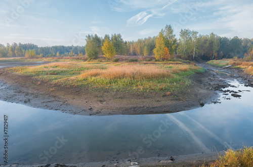 Autumn morning on shrinking river