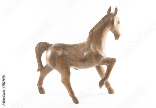 wooden horse is on a white background  © Suwatchai