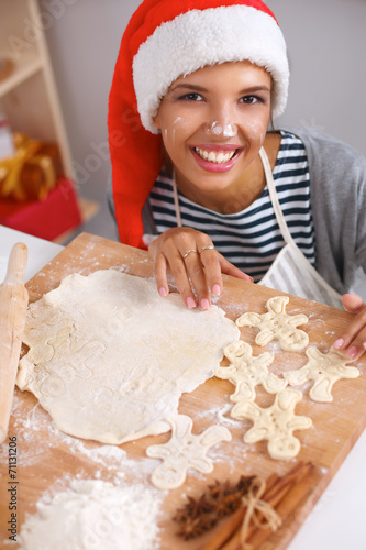 Happy young woman smiling happy having fun with Christmas prepa photo