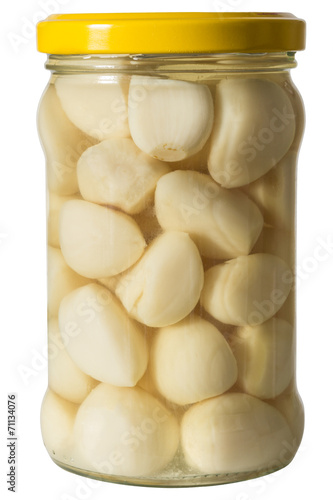 pickled garlic in a jar of white marjoram