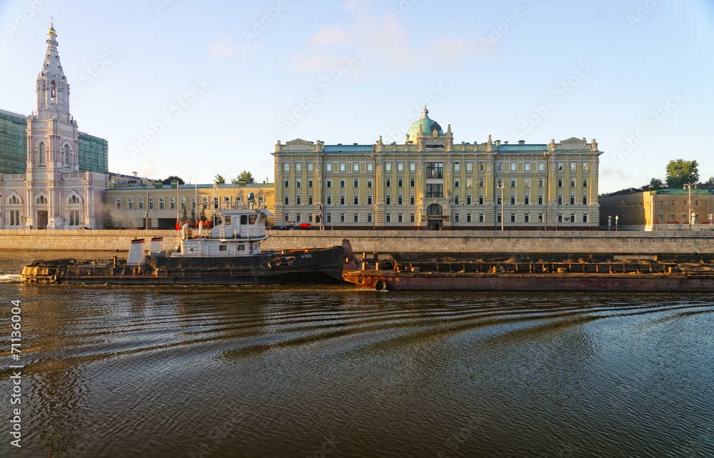 Tow boat in the Moscow river in front of major russian oil compa