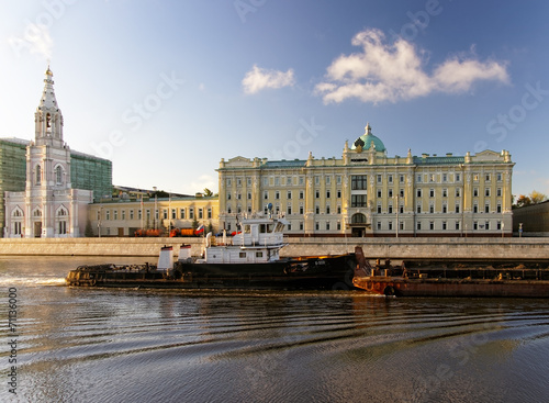 Tow boat in the Moscow river in front of major russian oil compa