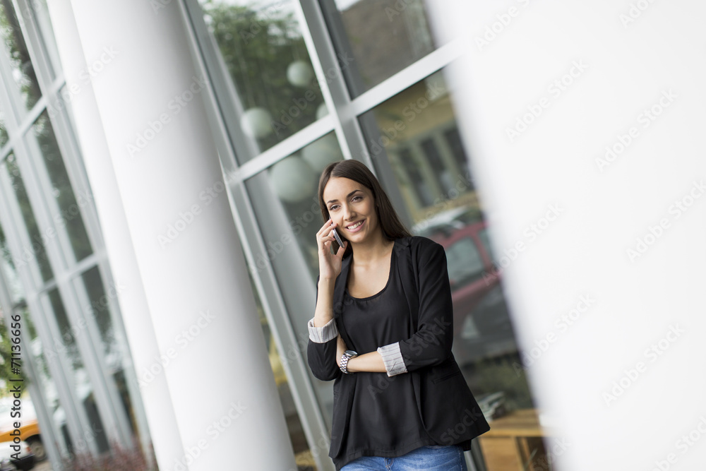 Young woman in front of office Young woman in front of office