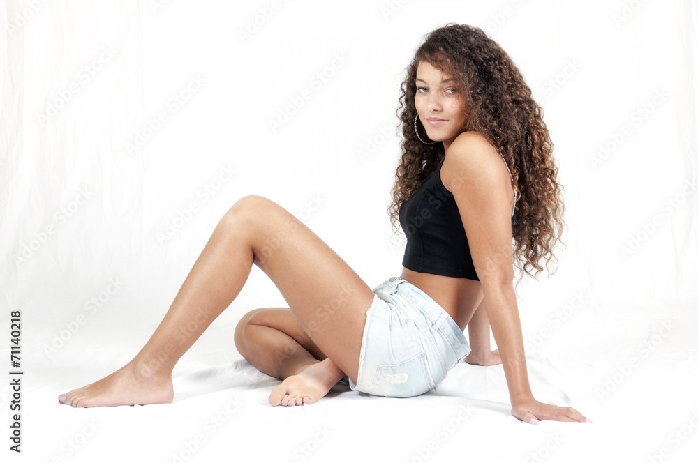 Jeune fille assise en short Stock Photo | Adobe Stock