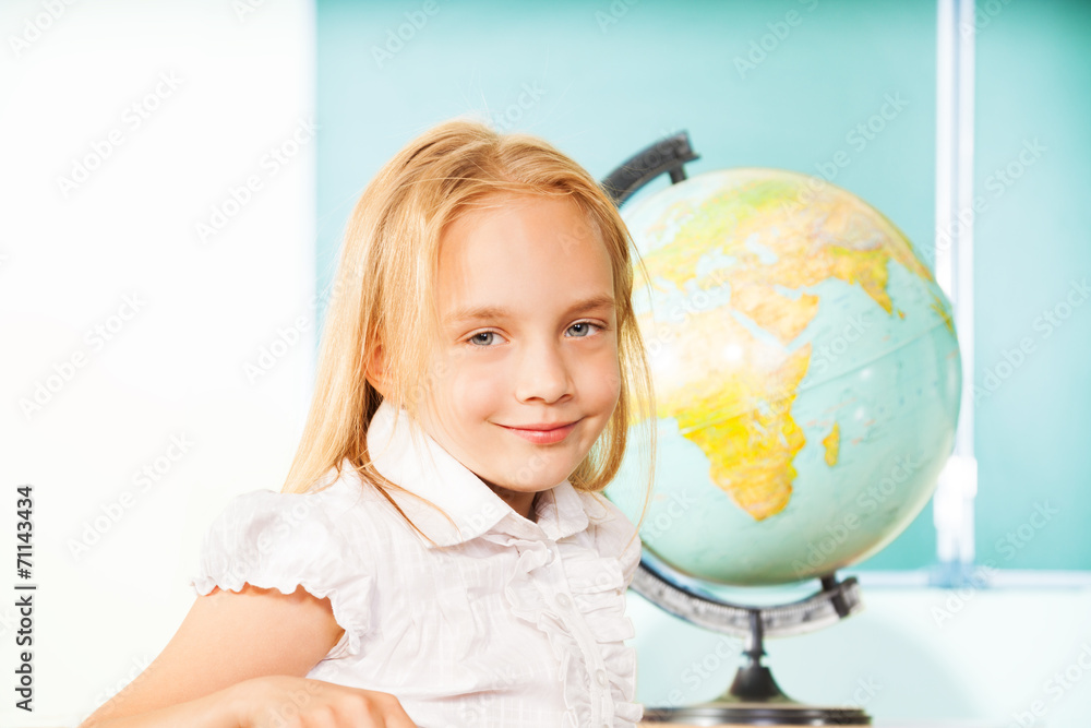 Blond girl portrait with globe and blackboard Blond girl portrait with globe and blackboard