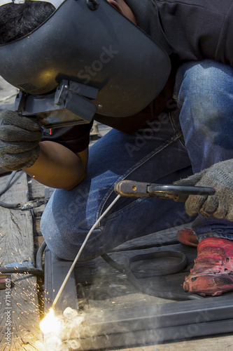 welder worker welding metal