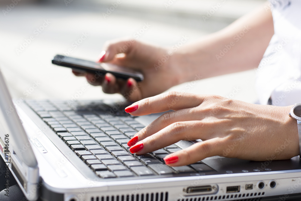 Hands of a businesswoman typing on a computer keyboard Hands of a businesswoman typing on a computer keyboard
