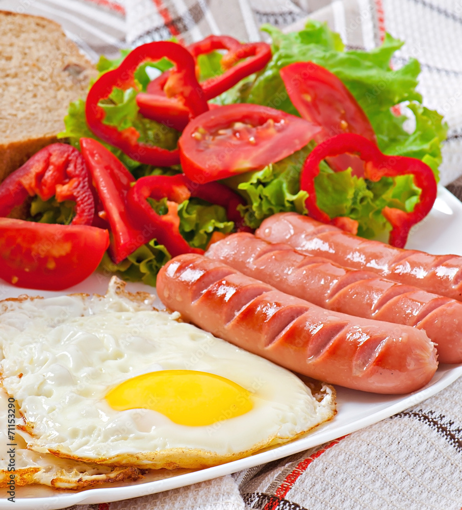 English breakfast - sausages, eggs, beans and salad English breakfast - sausages, eggs, beans and salad